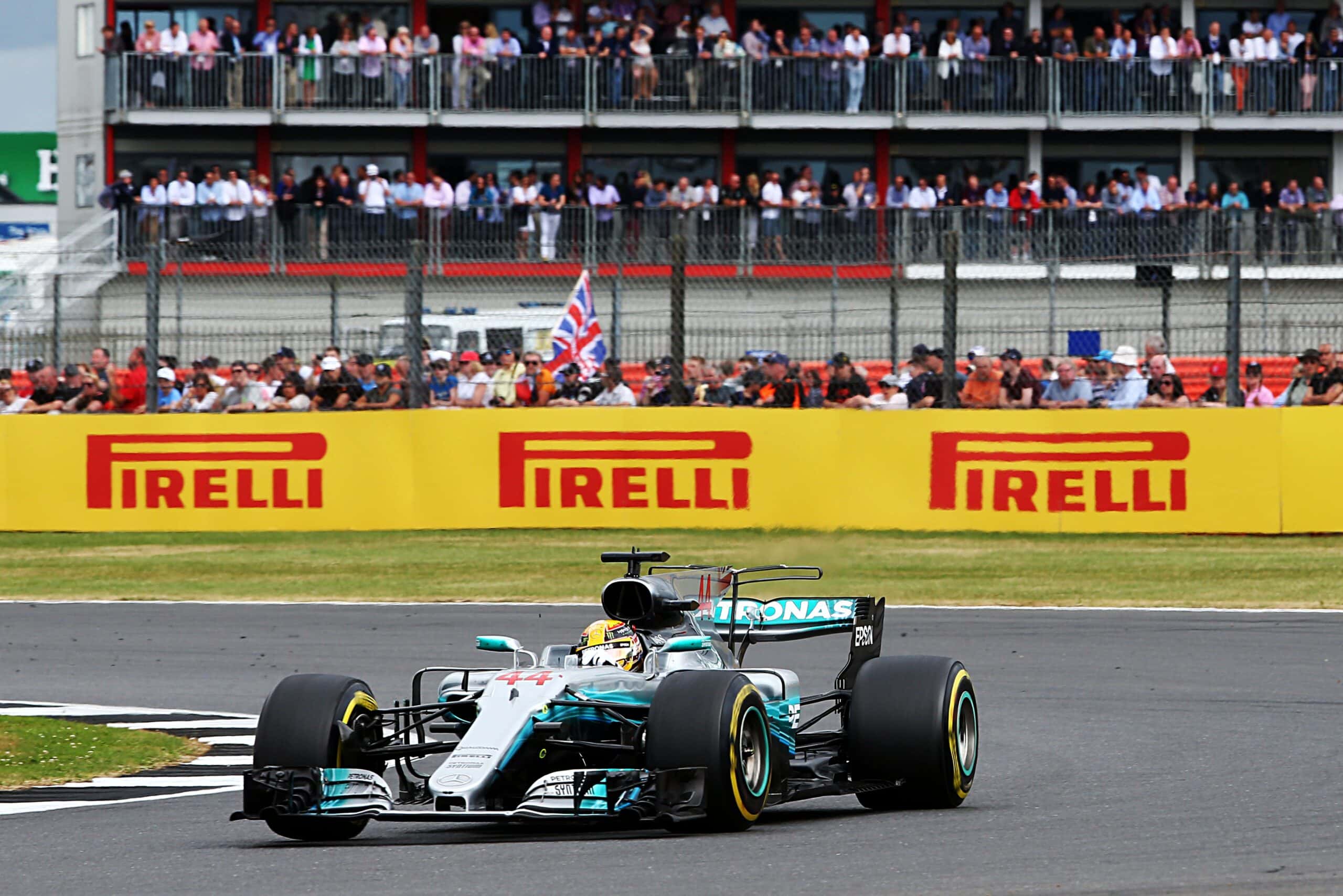 Racing car going past stands